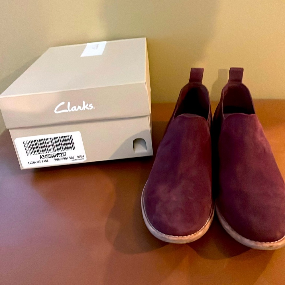 Clarks burgundy suede low heel pull on ankle boot with heel tab. Hardly worn.